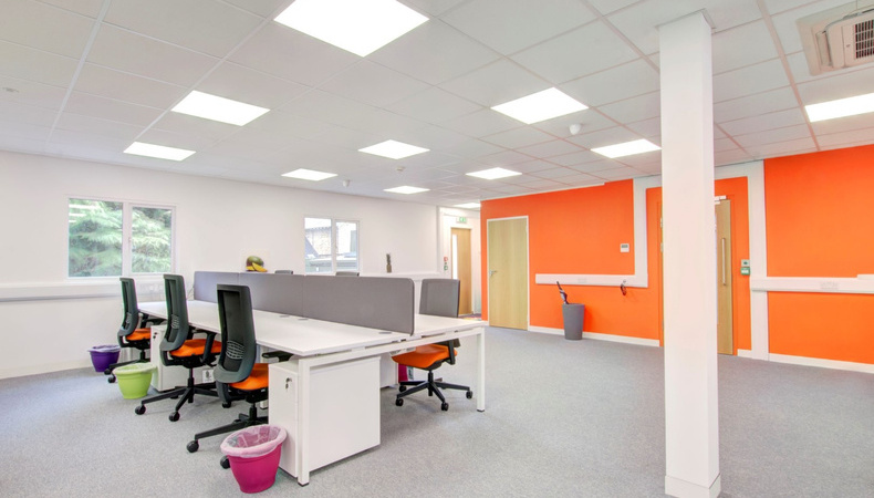 anofficewithsharedfurnituresolutionsananorangewalls_1622