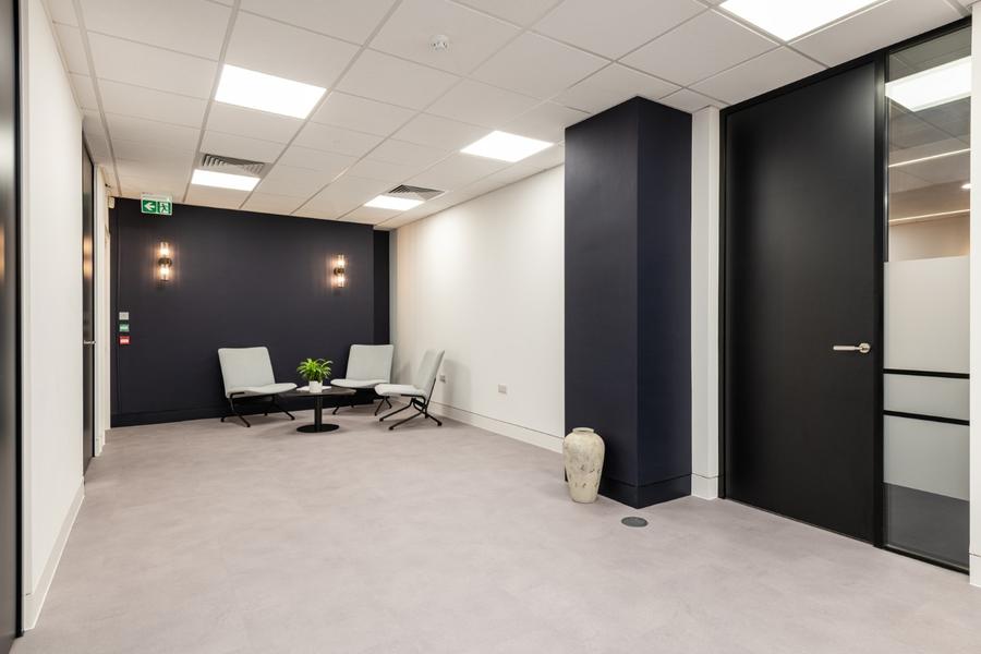 London office interior design with soft seating in visitors waiting area.jpg
