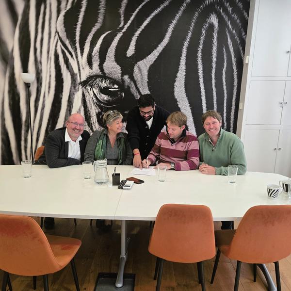 Signing the deal at Acumen Law.jpeg